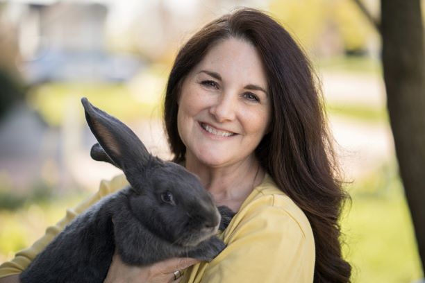 Kim White holding a grey bunny