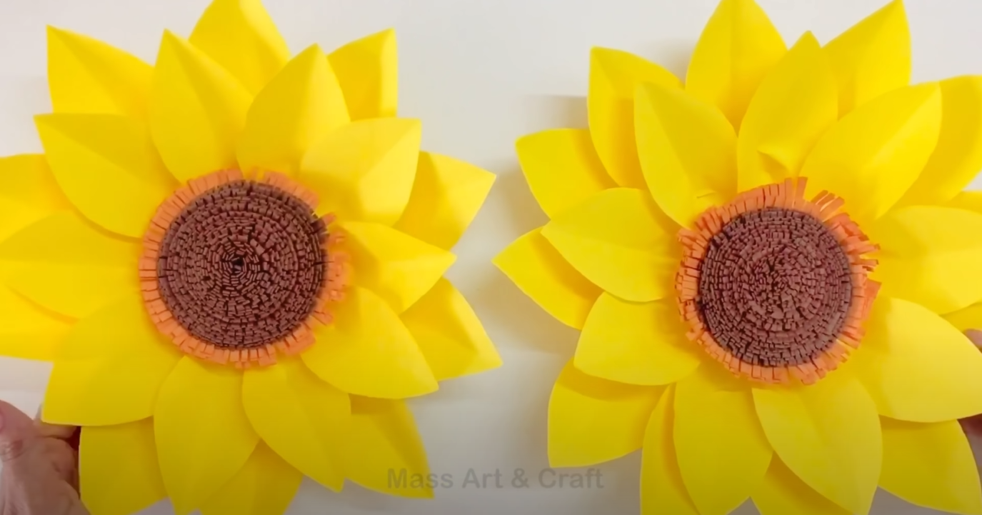 Image depicts 2 paper sunflowers.