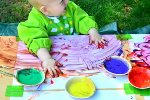 Picture of a baby finger painting 