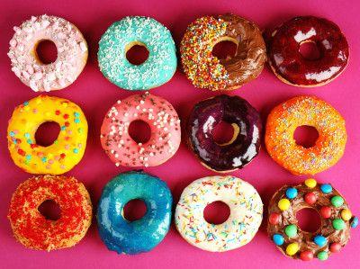 Pink background with colored doughnuts