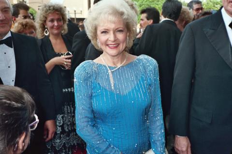 Betty White ina blue gown at an awards ceremony