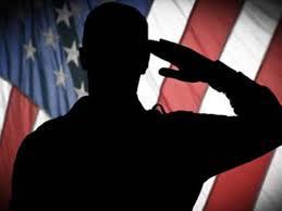 American flag with a figure giving a salute