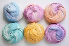Picture of six balls of different colored fluffy slime