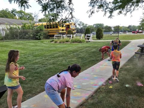 Picture of patrons playing with colored chalk "bombs"