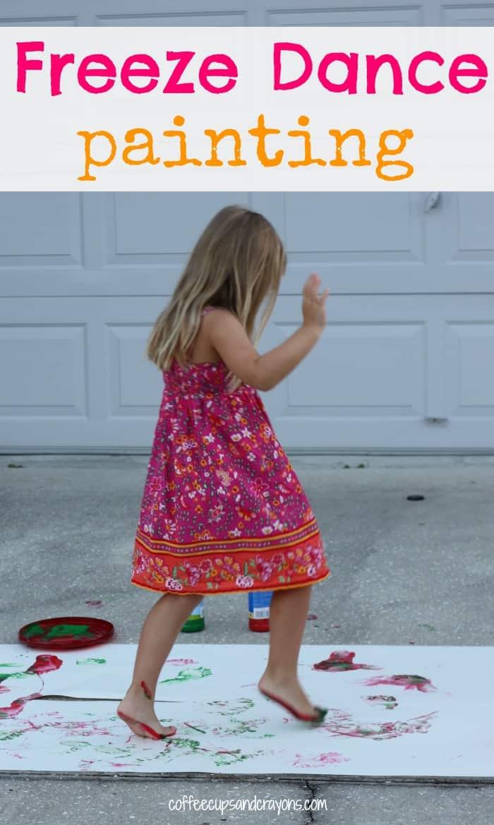 Picture of girl running and dancing through paint on long white paper. 