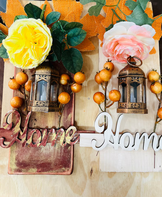 Fall lantern decor with flowers, ribbons, and craft sayings