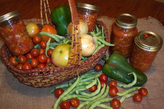 Fresh vegetables in basket and canning jars