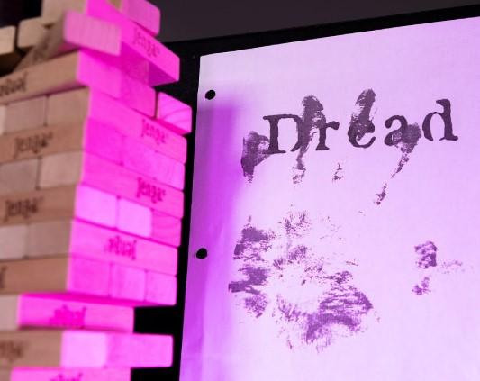 An image of Jenga and the cover for Dread.