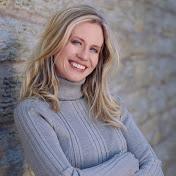 Picture of a blonde woman in a purple sweater